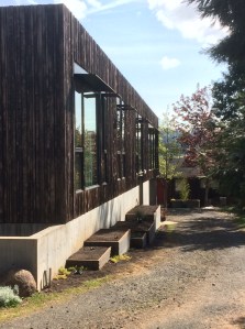 the ADU is tucked behind the new primary dwelling