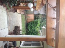 hardscaping and plantings create a transition zone between Scott Powers' main house and the ADU