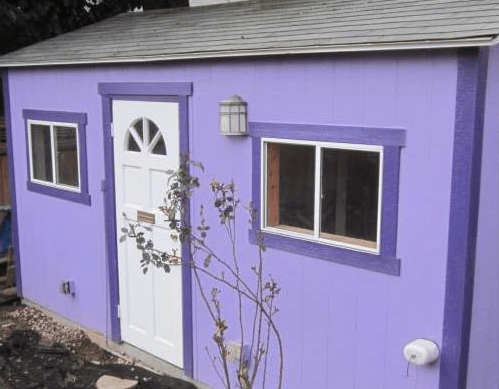 photo of a very small purple shed for rent as a dwelling