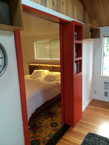 Caleb Bruce even included built-in storage in the sliding track door that closes off the bedroom!
