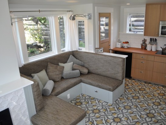 Stephanie & Sam Dyer's couch triples as a dinette and a guest bed