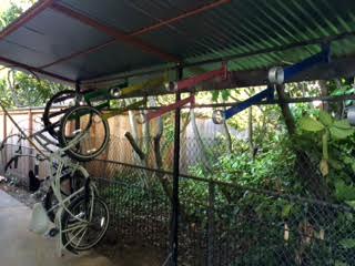 This custom bike rack, designed and build by Gustav Artist (who did most of the work on Lisa's ADU) allows the housemates plenty of bike parking.